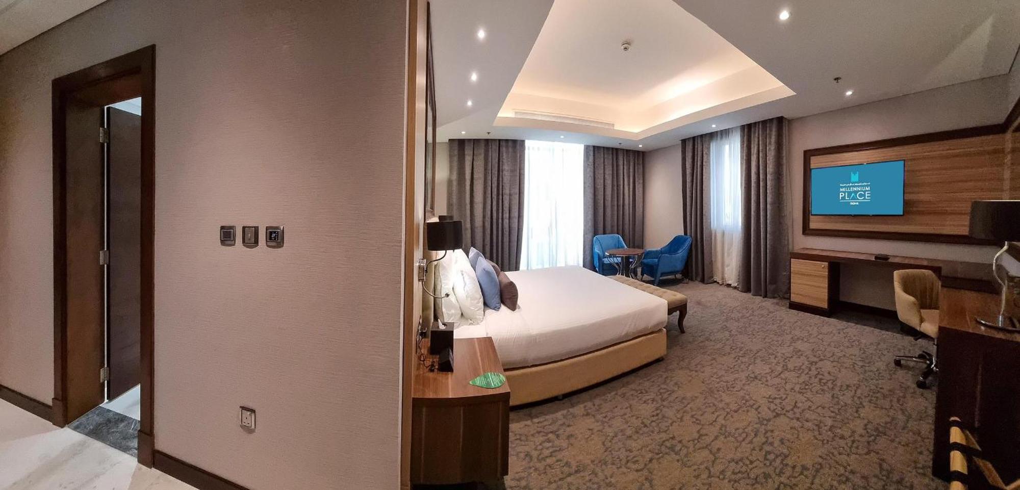 Millennium Place 도하 외부 사진 A bedroom at the hotel